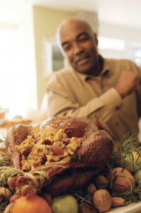 Man Looking at Cooked Turkey, Blurred.