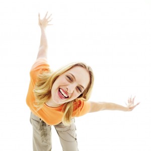 Young Woman Bending Down and Smiling with Arms Stretched Back